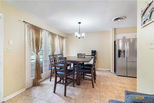 204 W Johnson St, Cuero, TX 77954 - dining area with a chandelier and light tile patterned floors