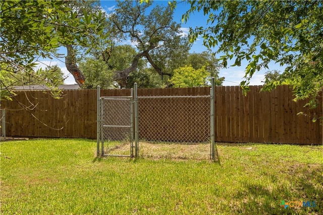 204 W Johnson St, Cuero, TX 77954 - view of yard featuring a gate