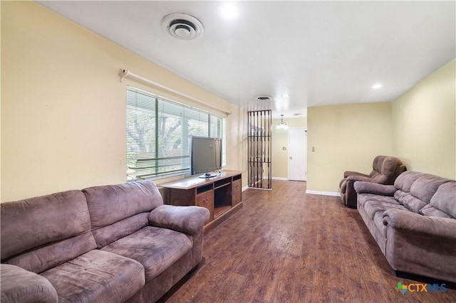 204 W Johnson St, Cuero, TX 77954 - living area featuring dark wood-style floors and baseboards