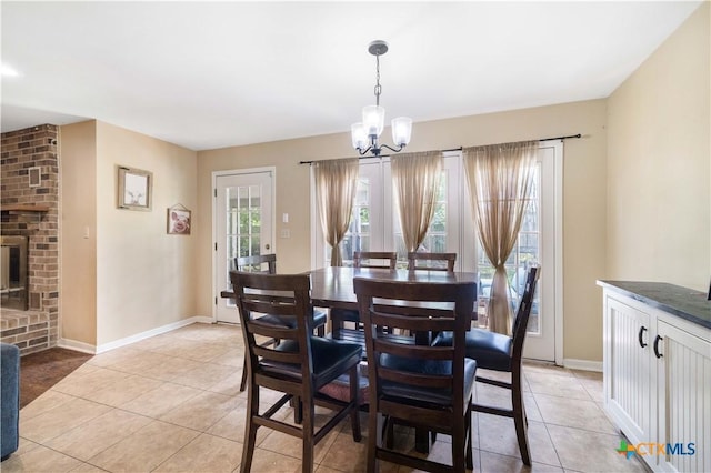 204 W Johnson St, Cuero, TX 77954 - dining area featuring light tile patterned flooring and a chandelier