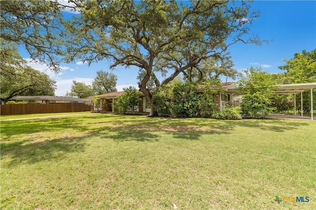 204 W Johnson St, Cuero, TX 77954 - view of yard featuring a carport