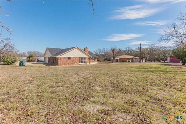 view of yard with a garage