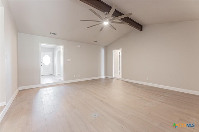 empty room featuring vaulted ceiling with beams, visible vents, baseboards, a ceiling fan, and light wood-type flooring