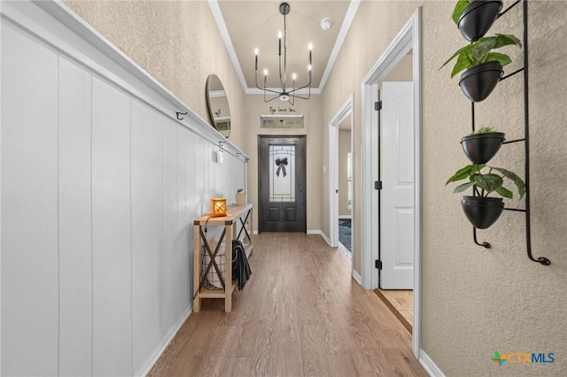 1442 Neff Dr, Copperas Cove, TX 76522 - foyer entrance featuring ornamental molding, a chandelier, wood finished floors, and a textured wall