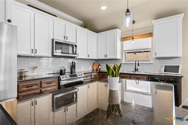 1442 Neff Dr, Copperas Cove, TX 76522 - kitchen with stainless steel appliances, decorative light fixtures, white cabinets, and backsplash