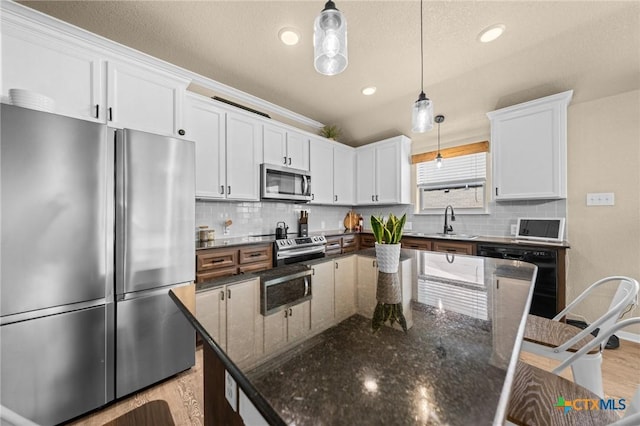 1442 Neff Dr, Copperas Cove, TX 76522 - kitchen with appliances with stainless steel finishes, white cabinetry, backsplash, decorative light fixtures, and recessed lighting
