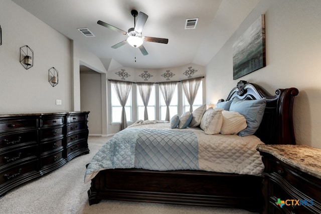 carpeted bedroom with ceiling fan and lofted ceiling