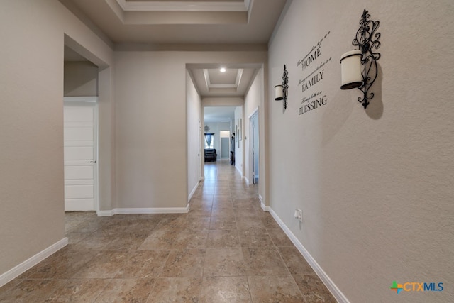 corridor with a tray ceiling