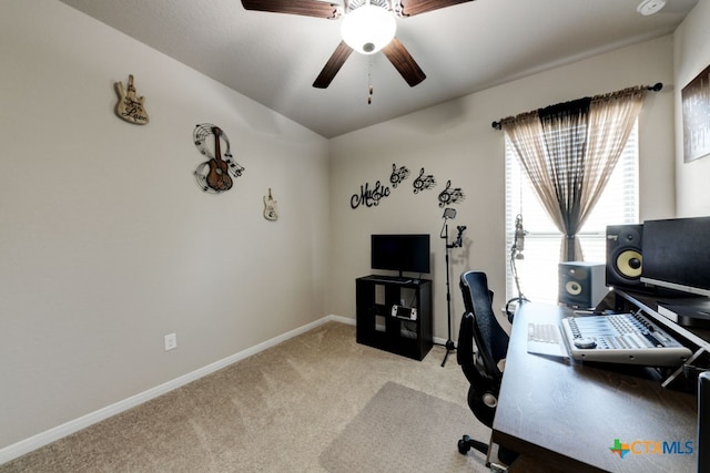 carpeted home office with ceiling fan