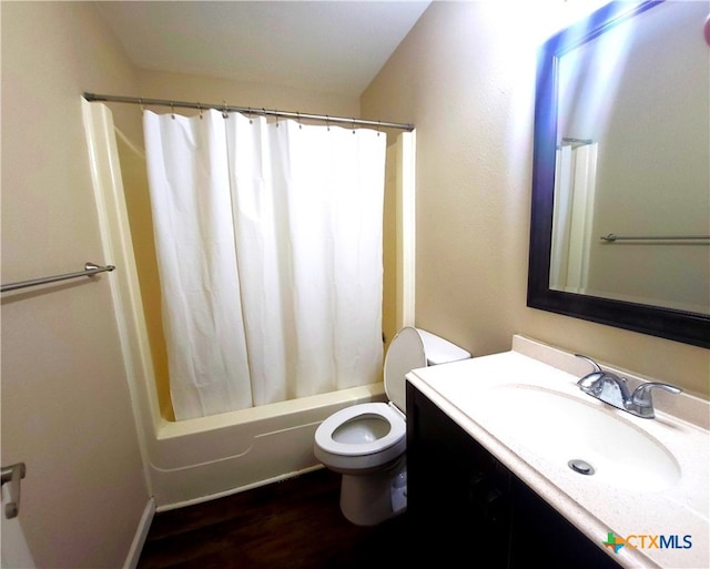 full bathroom with toilet, vanity, shower / bath combo with shower curtain, and wood-type flooring