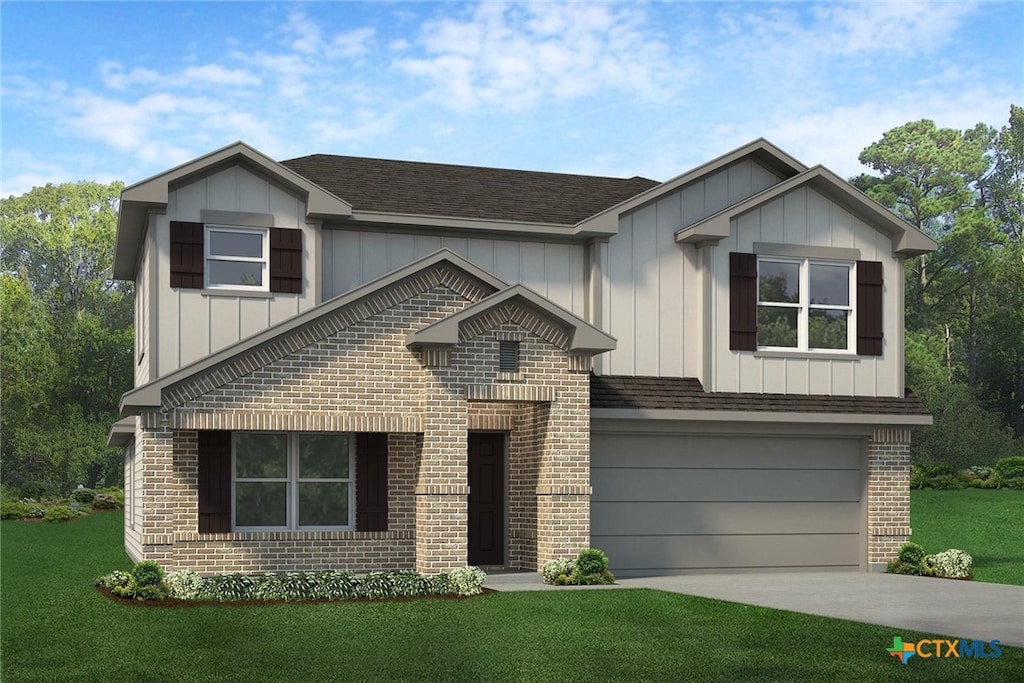 view of front of home with a front lawn and a garage