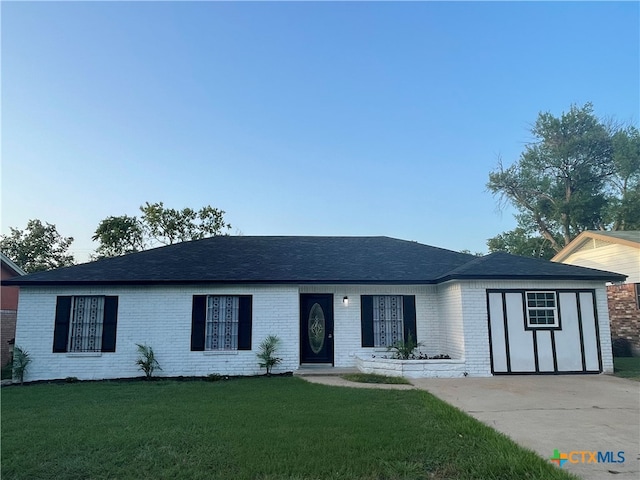 ranch-style house with a front lawn