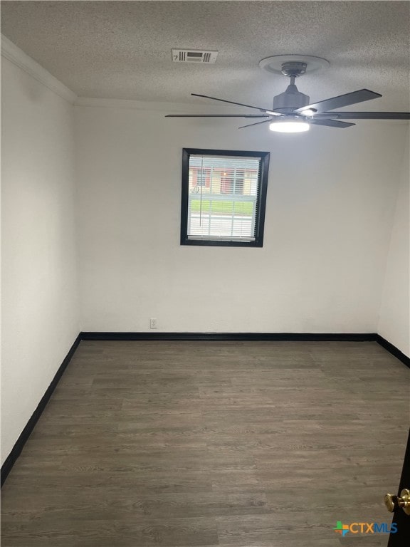 unfurnished room featuring crown molding, dark hardwood / wood-style flooring, a textured ceiling, and ceiling fan