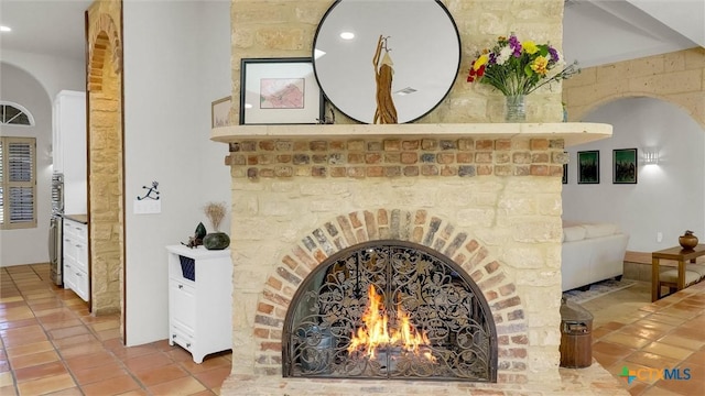 680 Saddleridge Dr, Wimberley, TX 78676 - room details with arched walkways, recessed lighting, and a fireplace