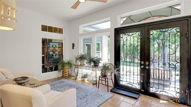 680 Saddleridge Dr, Wimberley, TX 78676 - entryway with french doors, a ceiling fan, and tile patterned floors