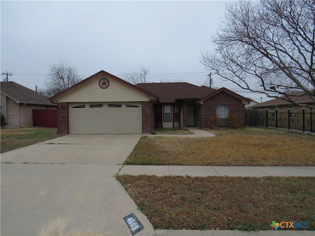 ranch-style house featuring a garage and a front yard