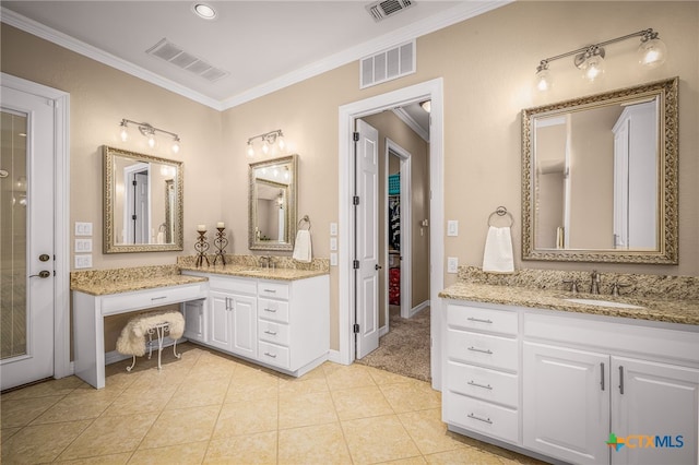 bathroom featuring ornamental molding, tile patterned floors, and vanity