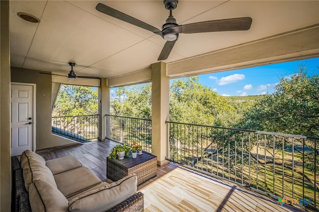 exterior space with ceiling fan and an outdoor hangout area