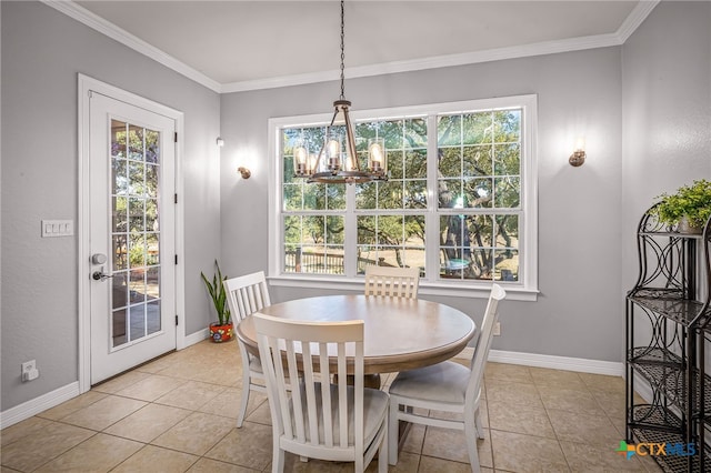 dining room with light tile patterned floors, ornamental molding, and a chandelier