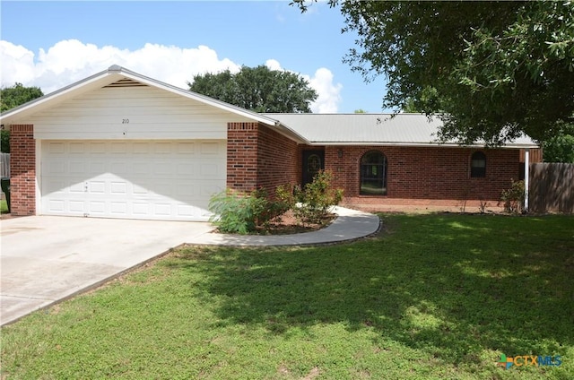 210 Meadow Ln, Martindale, TX 78655 - ranch-style home featuring brick siding, driveway, and a garage