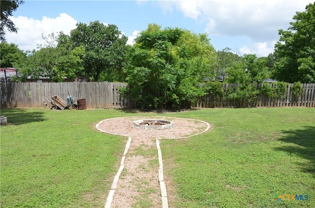 210 Meadow Ln, Martindale, TX 78655 - fenced backyard featuring a fire pit