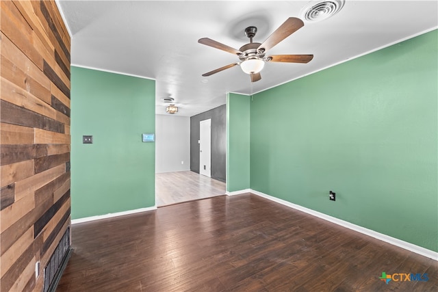 unfurnished room featuring ceiling fan and dark hardwood / wood-style flooring