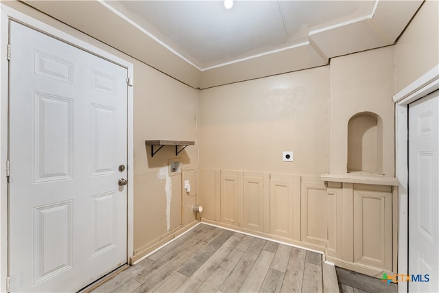 washroom featuring hookup for an electric dryer, hookup for a washing machine, and light wood-type flooring