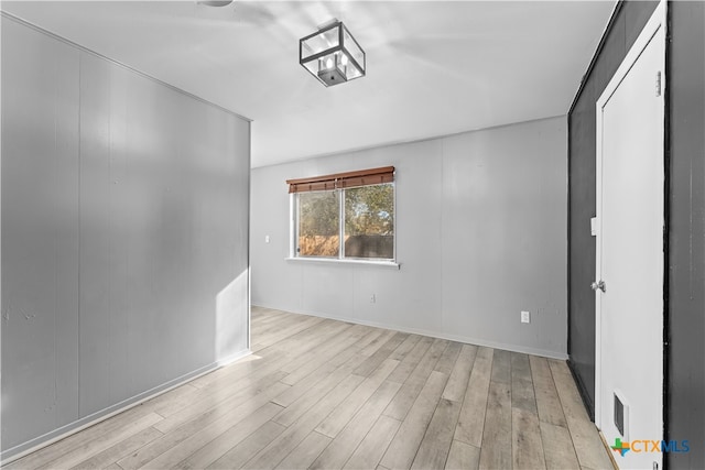 spare room featuring light wood-type flooring