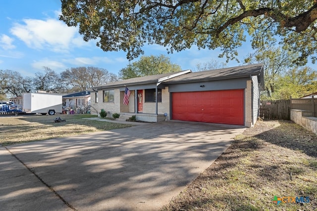 single story home featuring a garage