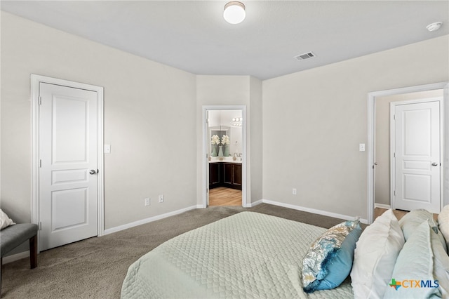 480 Waterloo Dr, Kyle, TX 78640 - bedroom featuring carpet, baseboards, and ensuite bathroom