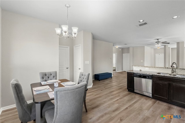 480 Waterloo Dr, Kyle, TX 78640 - dining space featuring a chandelier, light wood-style floors, ceiling fan, baseboards, and recessed lighting