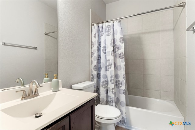 480 Waterloo Dr, Kyle, TX 78640 - bathroom with vanity, toilet, shower / bath combo, and a textured wall