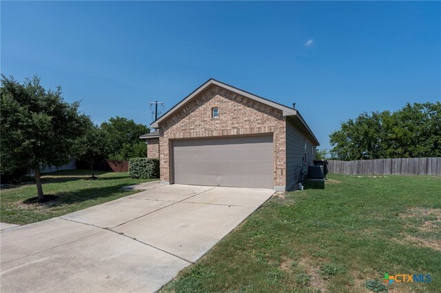 480 Waterloo Dr, Kyle, TX 78640 - view of home's exterior featuring brick siding, cooling unit, concrete driveway, and a garage