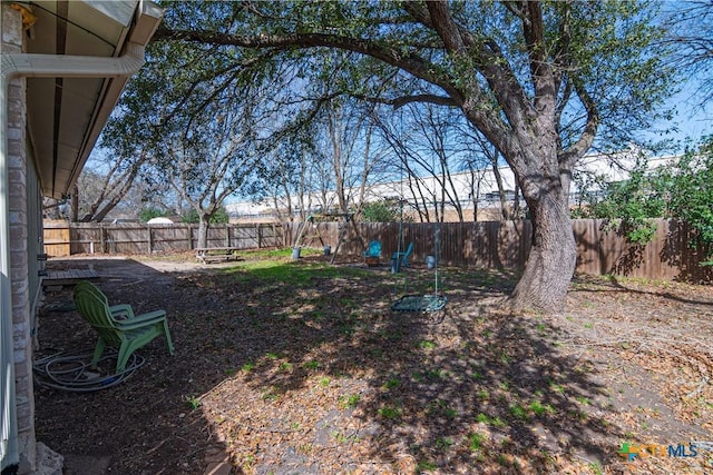 view of yard with a fenced backyard