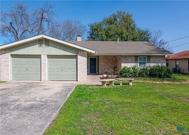 ranch-style house with a front yard, a chimney, concrete driveway, and brick siding