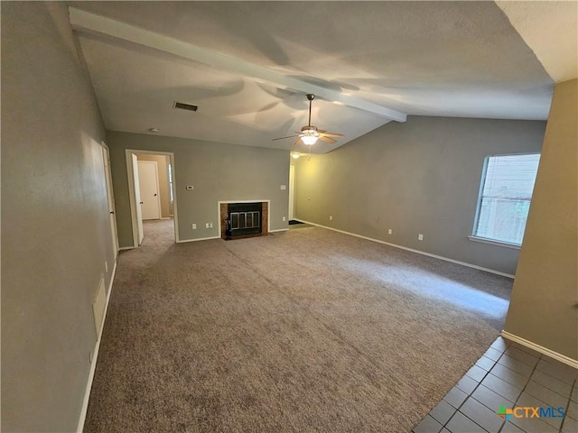 unfurnished living room featuring visible vents, a ceiling fan, carpet flooring, baseboards, and lofted ceiling with beams