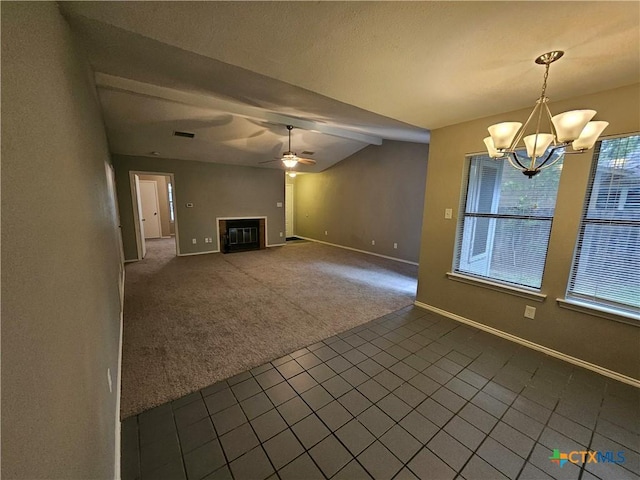unfurnished living room with baseboards, ceiling fan with notable chandelier, dark colored carpet, lofted ceiling, and a glass covered fireplace
