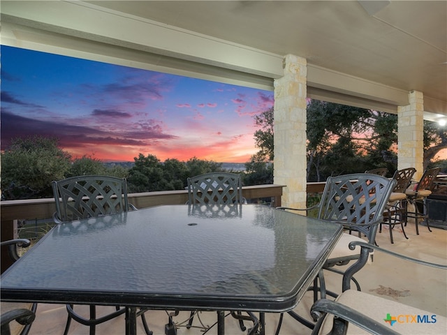 view of patio terrace at dusk