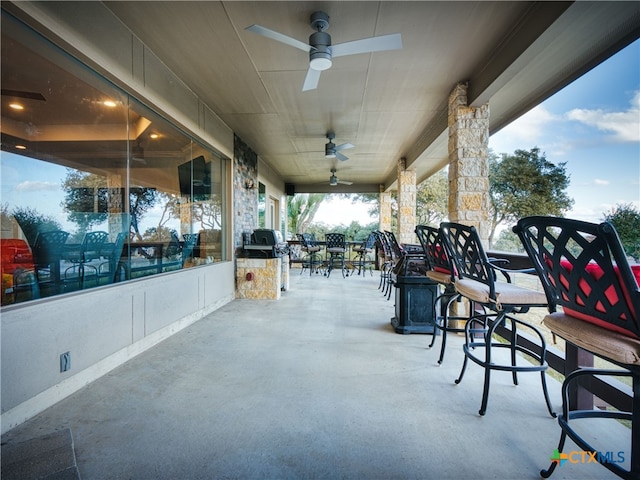 view of patio / terrace featuring ceiling fan