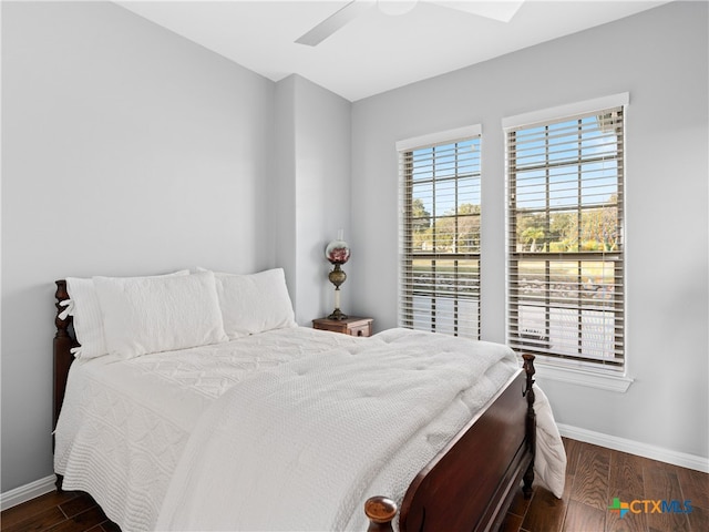 bedroom featuring ceiling fan and dark wood-type flooring