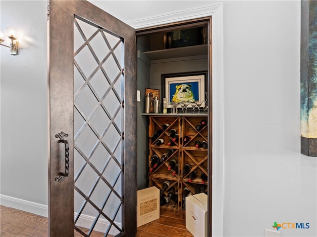 wine cellar with hardwood / wood-style floors