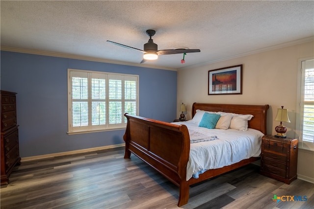 bedroom with dark wood-type flooring, ceiling fan, and multiple windows