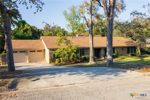 ranch-style home with a garage