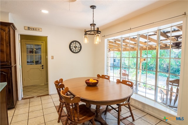 dining space featuring light tile patterned flooring