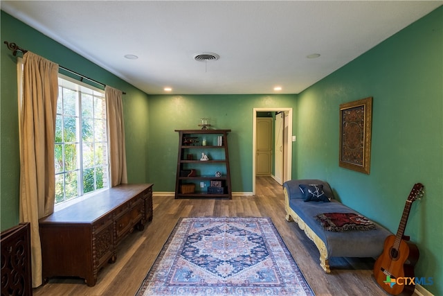 living area with hardwood / wood-style floors