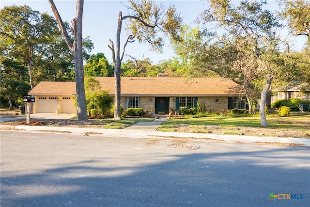 ranch-style house featuring a garage