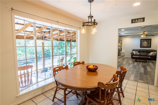 tiled dining room with ceiling fan