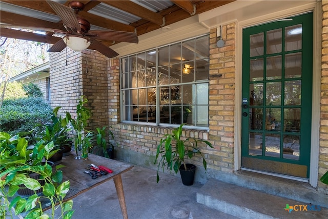 property entrance with ceiling fan