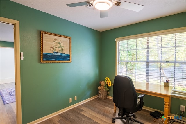 office space featuring hardwood / wood-style floors and ceiling fan