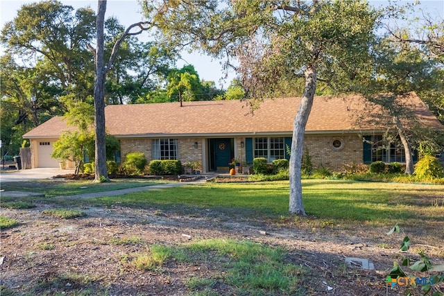 ranch-style house with a garage and a front yard